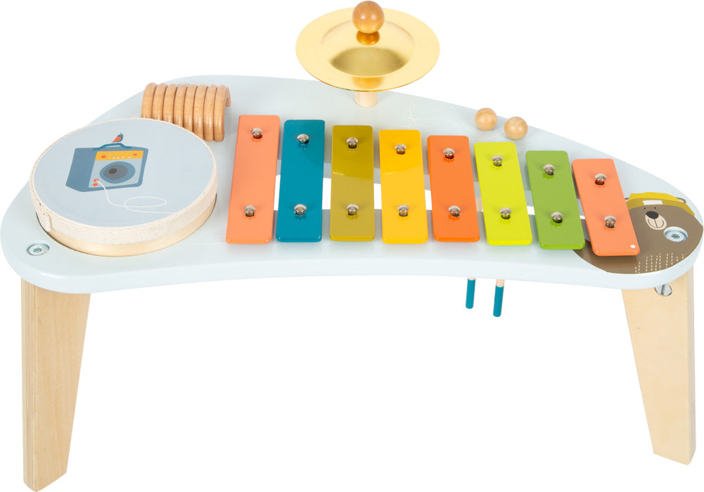Mesinha musical small foot tons pastel com xilofone, pratos, chocalho e tambor, ideal para crianças a partir dos 3 anos.