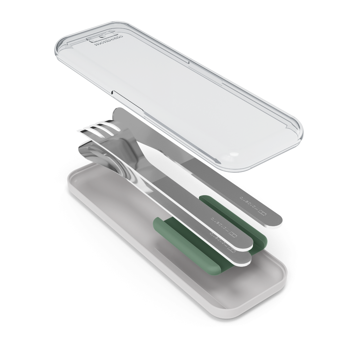 Conjunto de talheres Monbento em aço inoxidável (faca, garfo, colher) com suporte verde, fora da caixa de transporte transparente.