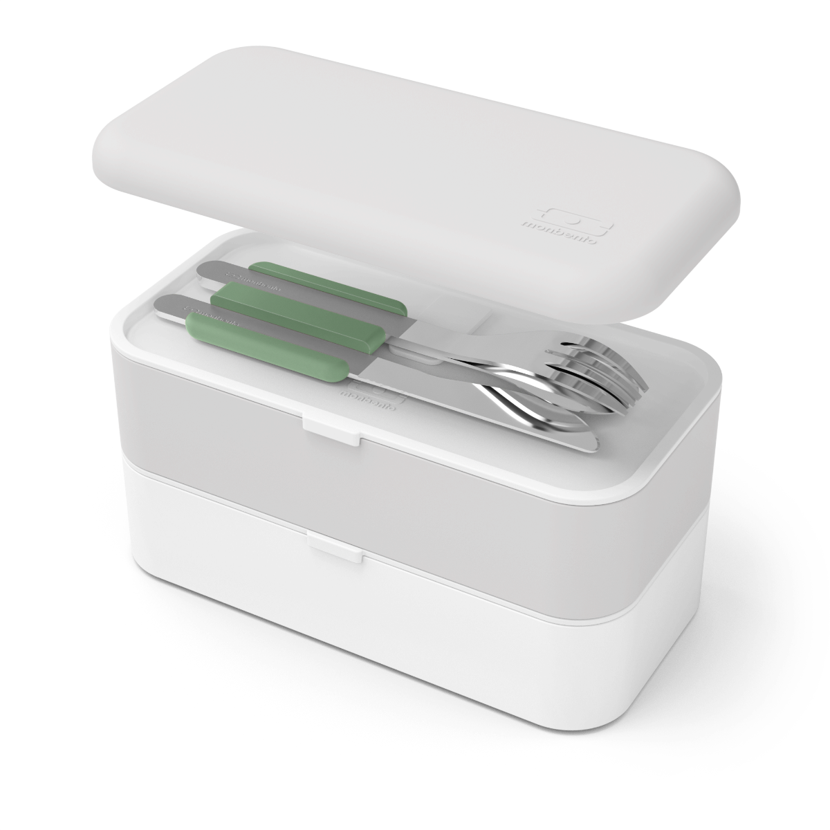 Talheres Monbento em aço inox com suporte verde guardados no estojo de transporte cinzento e branco, com tampa aberta.