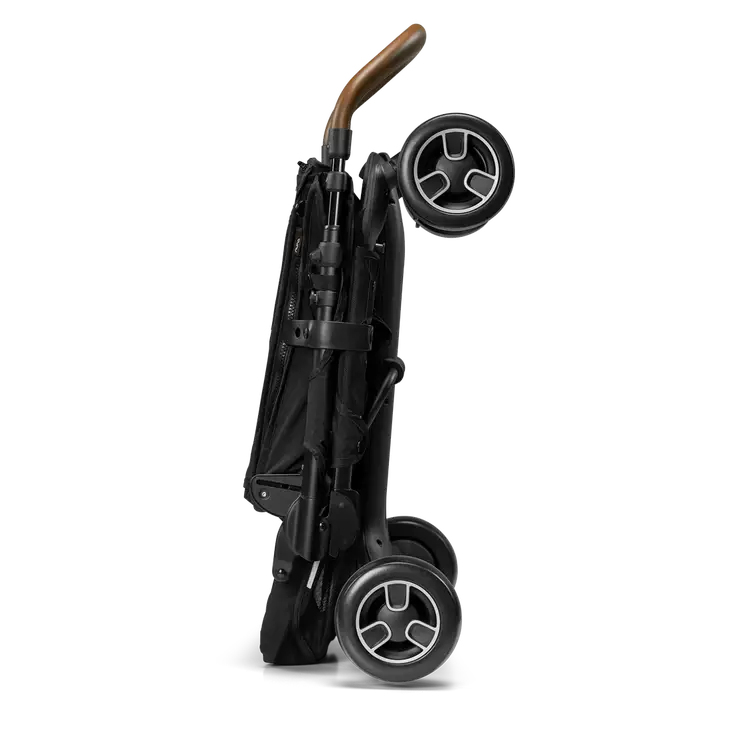 Detalhe do sistema de fecho magnético MagneTech Secure Snap™ do arnês do carrinho Nuna PEPP NEXT.