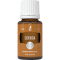 Frasco de óleo essencial de Copaíba Young Living 15ml sobre fundo neutro