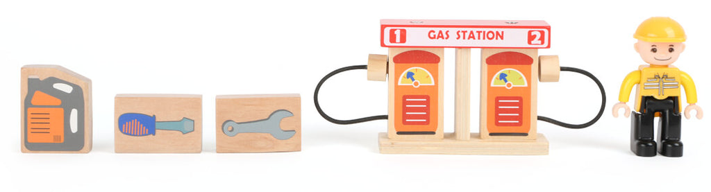 Detalhe da área de lavagem de carros na oficina de brincar, com rolos móveis e rampa de saída.