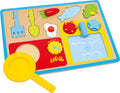 Puzzle de madeira "Pequeno Almoço" da small foot, mostrando o tabuleiro completo com todas as peças de alimentos e utensílios encaixadas.