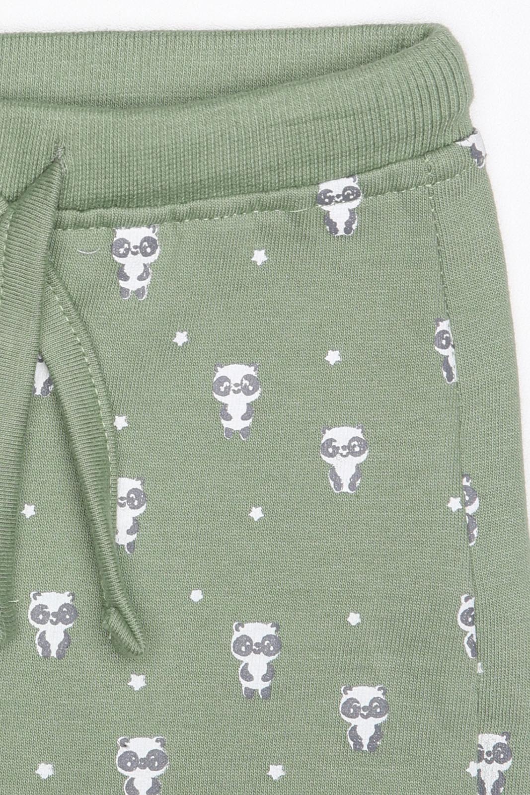 Calças estilo jogger com estampa verde e laranja, cintura elástica e cordão, do conjunto Street Monkey.