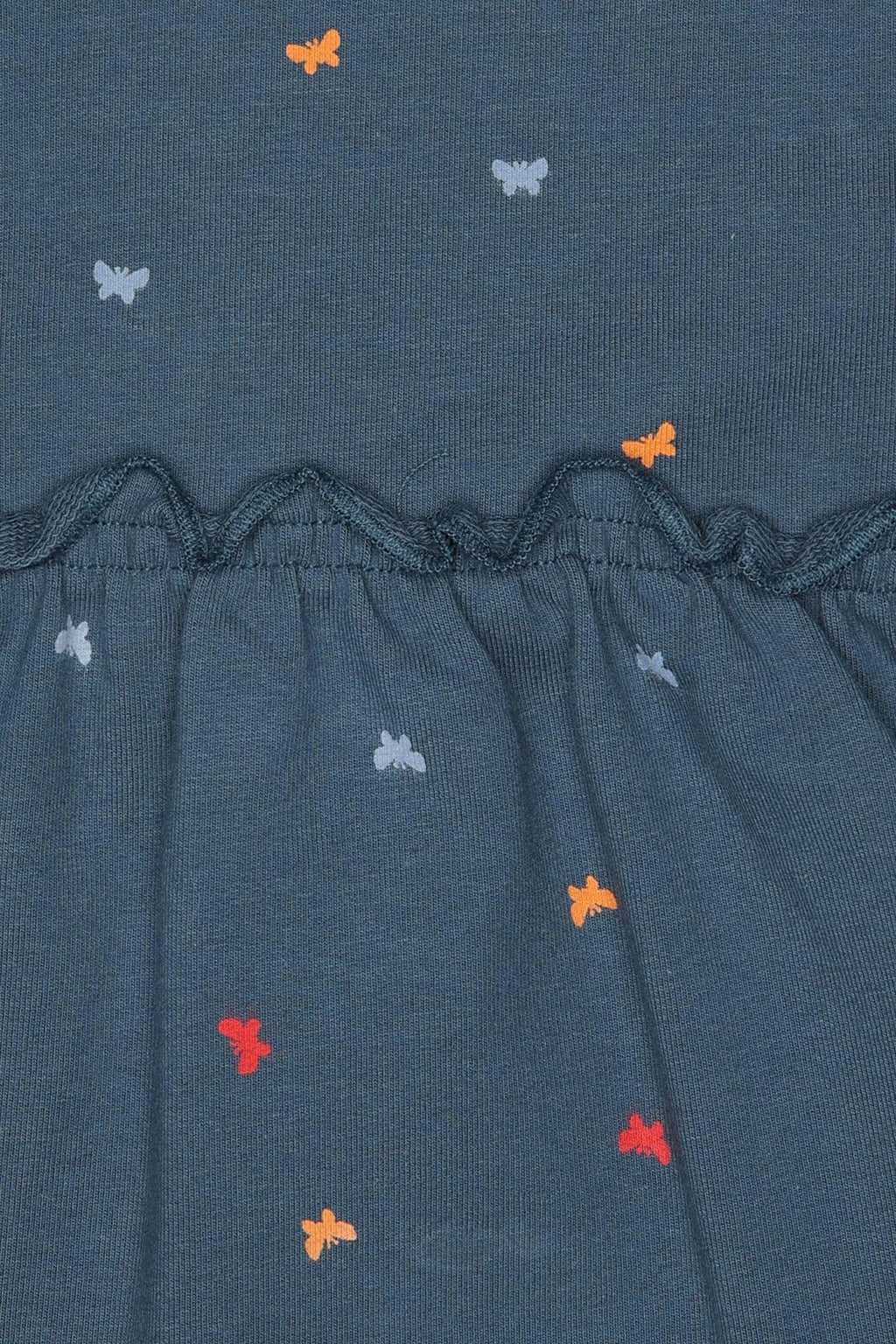 Detalhe das costas do vestido Street Monkey, focando no fecho de correr plástico interno, essencial para o vestir e despir.