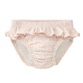 Cueca/fralda de praia Waterlemon rosa com bolinhas, vista frontal, com folho decorativo e elástico nas pernas.