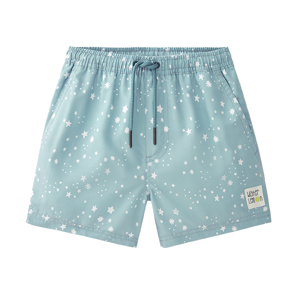 Calção de praia Waterlemon azul para menino, com padrão de estrelas brancas, cintura elástica e cordão de ajuste frontal.
