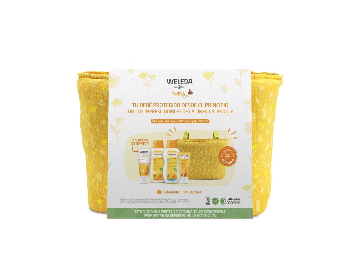 Pack Weleda Bem-vindo Bebé com bolsa de passeio, mostrando os quatro produtos essenciais e a bolsa num cenário acolhedor.