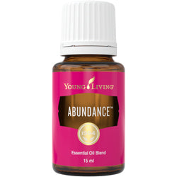 Frasco de 15ml do óleo essencial Young Living Abundance, com rótulo em destaque, mostrando a tampa de segurança.