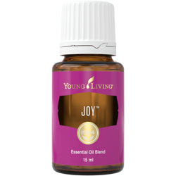 Frasco de 15ml do óleo essencial Joy da Young Living, com rótulo branco e tampa preta, em destaque.