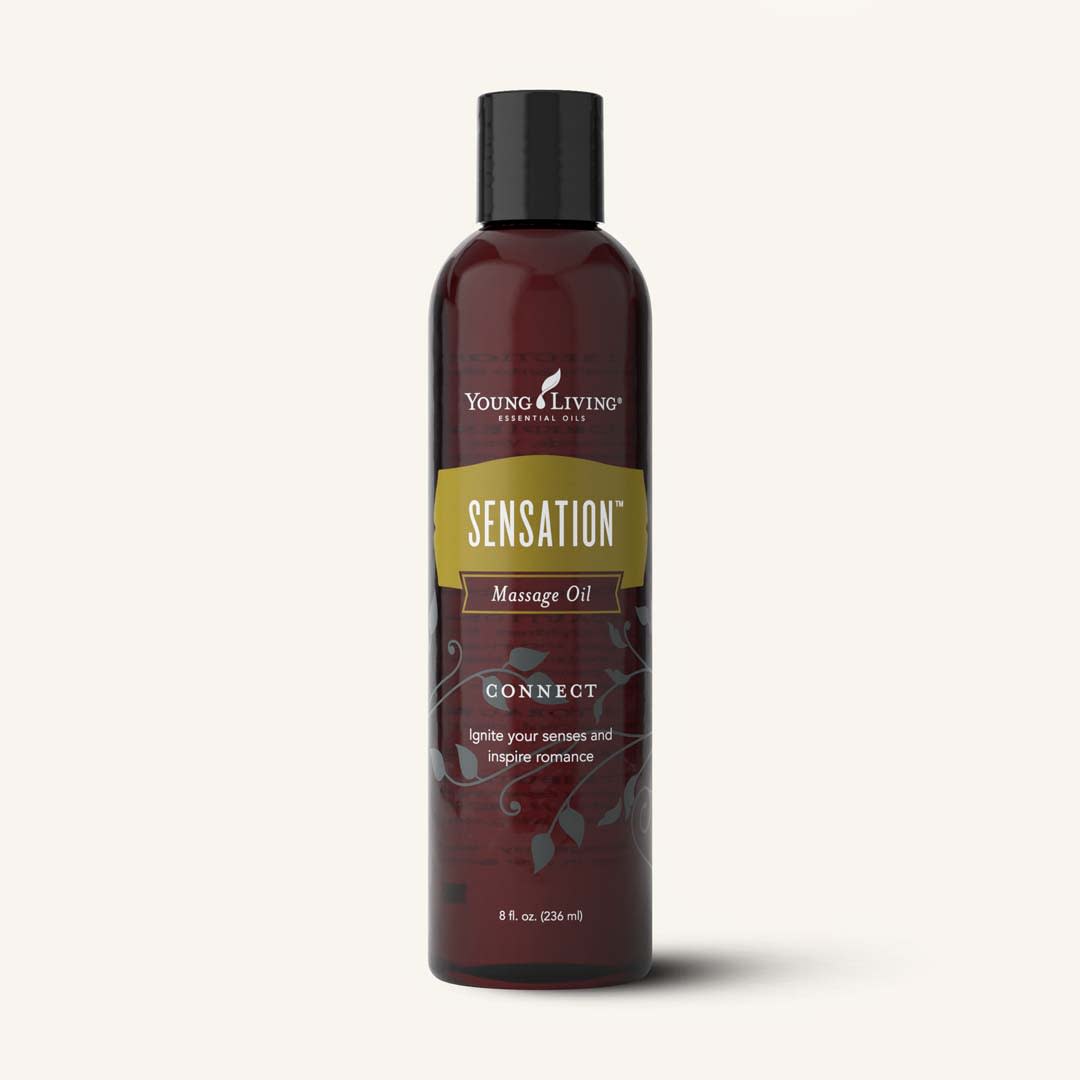 Frasco de 236ml do Óleo de Massagem Sensation da Young Living, com rótulo branco e detalhes românticos, ideal para massagens relaxantes.